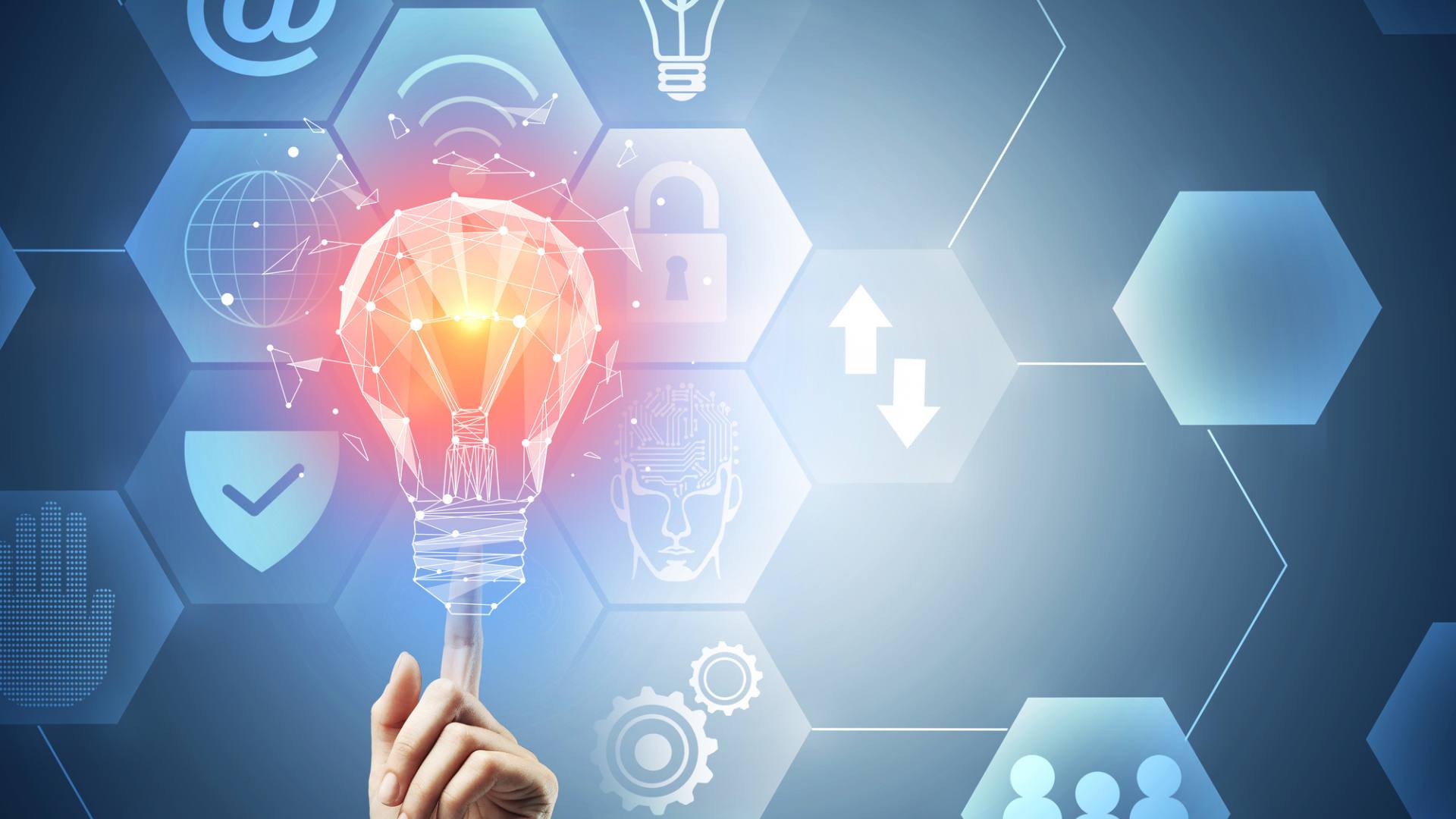 Hand holding a light bulb with emerging tech images in the background