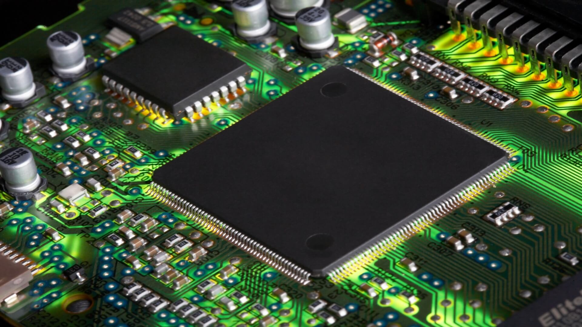 Green computer circuit board with semiconductor chip