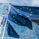 EU flags flying in front of the European Commission