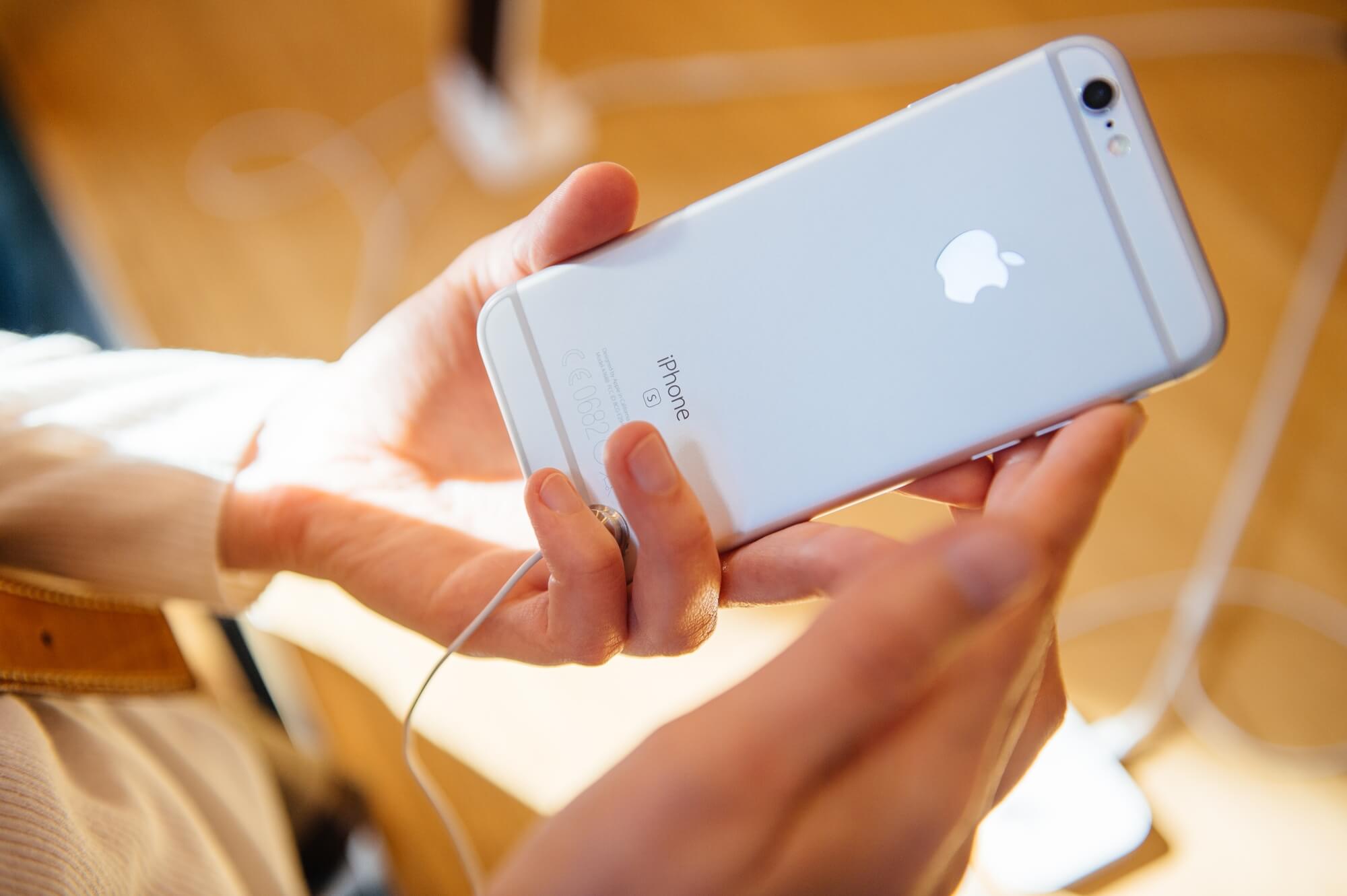 A hand holding Apple iPhone