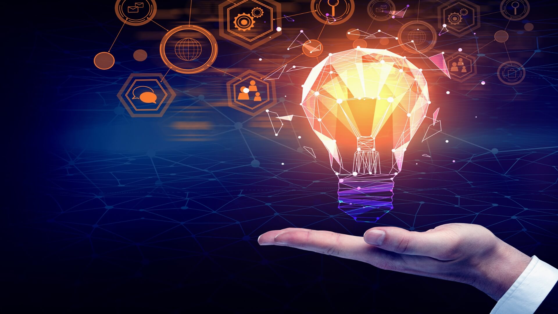 A hand holding a lighted light bulb with a dark tech background