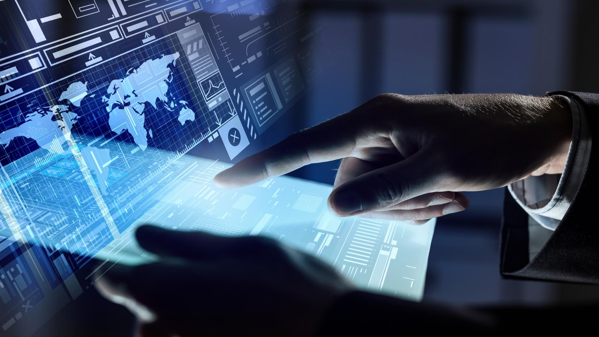 A hand pointing to a high tech image